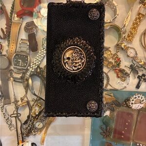 Black Textured Wallet with Decorative Medallions